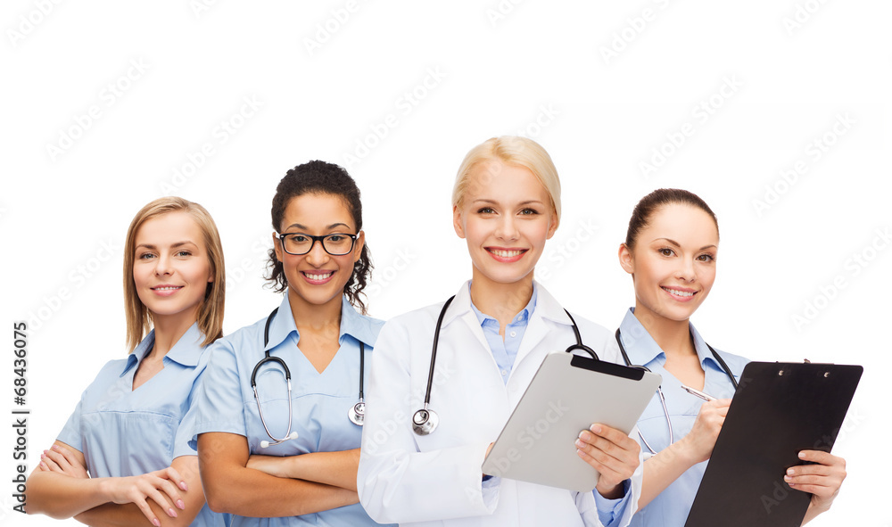 smiling female doctor and nurses with tablet pc smiling female doctor and nurses with tablet pc