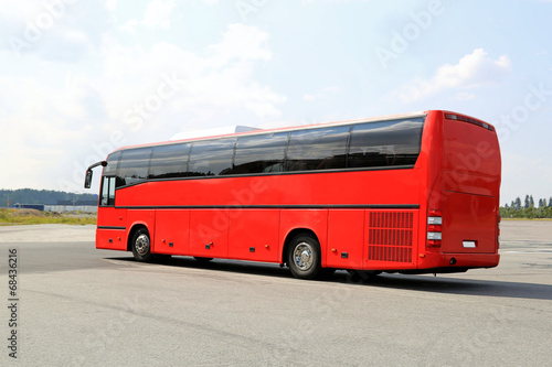 Red Coach Bus Departs on a Journey