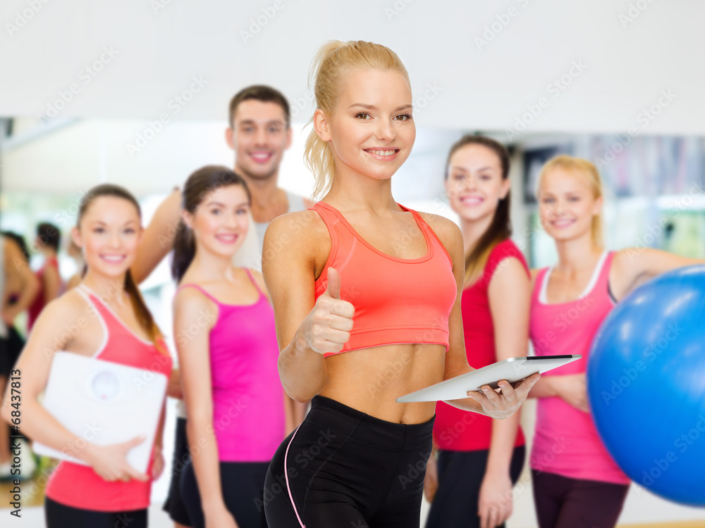 smiling sporty woman with tablet pc computer smiling sporty woman with tablet pc computer