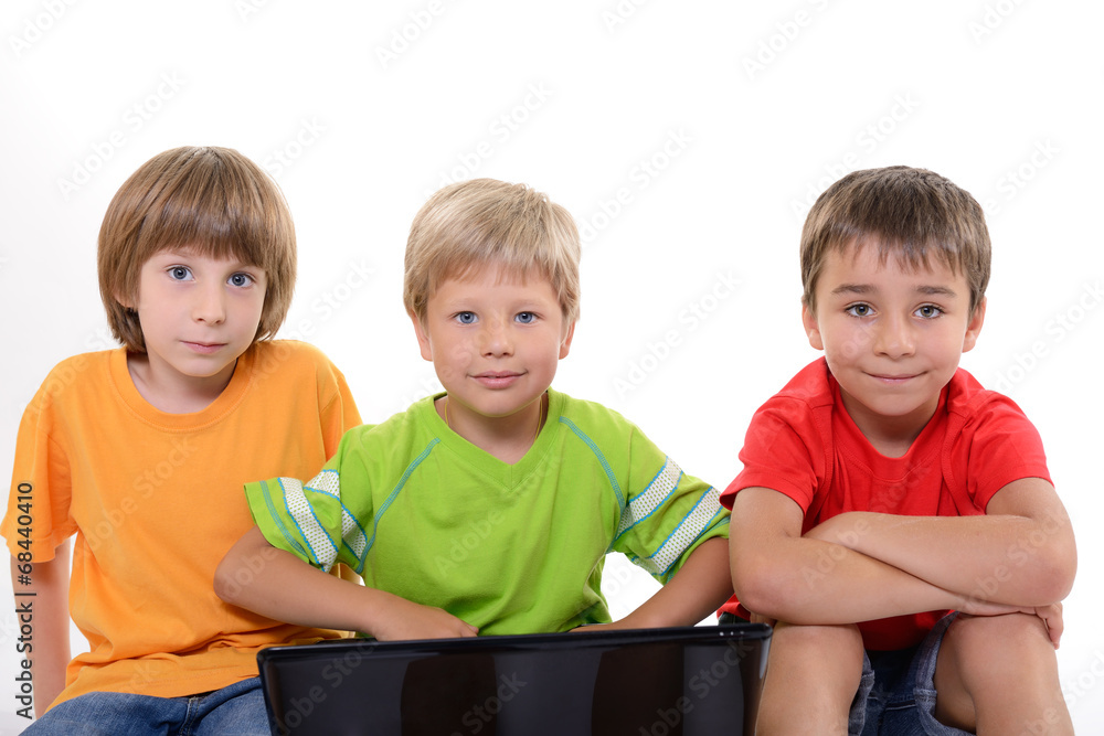 Portrait of smart schoolboys with laptop, over white Portrait of smart schoolboys with laptop, over white