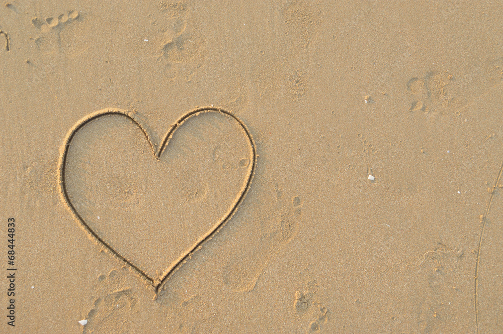 heart symbol drawn in the sand