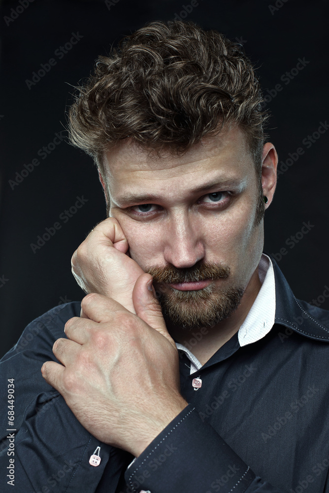 Tired bearded unhappy manager rely on his hand looking Tired bearded unhappy manager rely on his hand looking