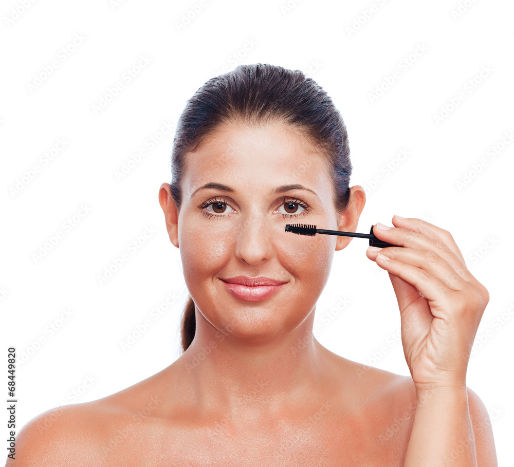 Beauty treatment woman applying Mascara - isolated on white Beauty treatment woman applying Mascara - isolated on white