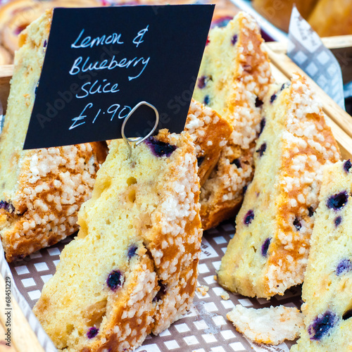 Delicious lemon and raspberry cake slices in British market
