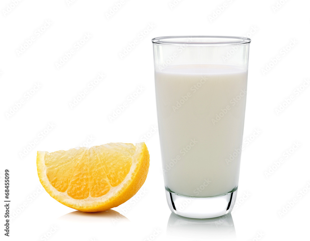 Glass of milk and Half lemon fruit on white background, fresh an Glass of milk and Half lemon fruit on white background, fresh an
