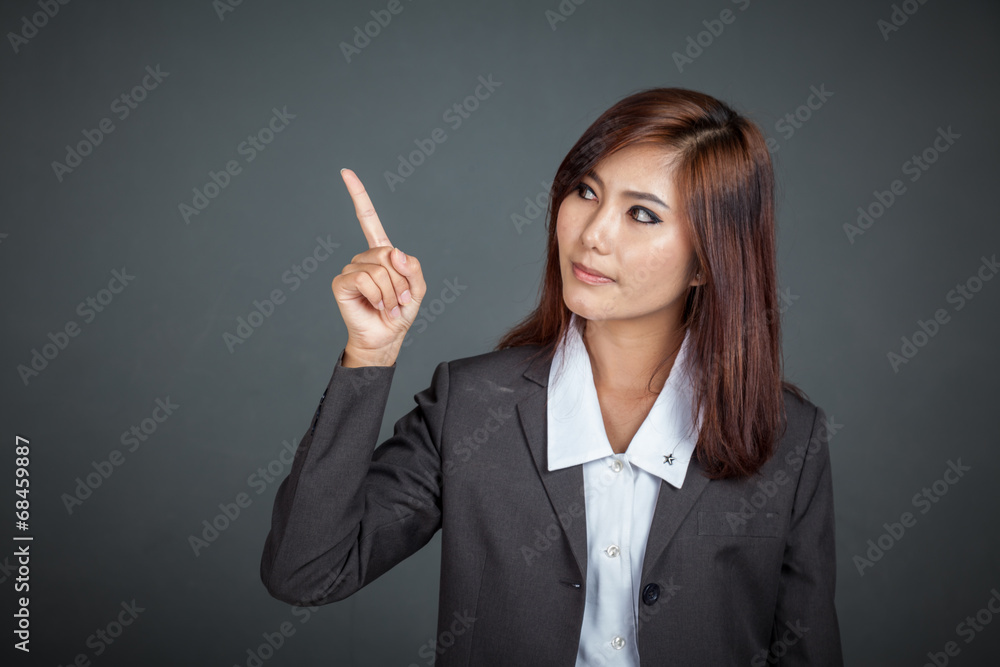 Asian business woman point to her left