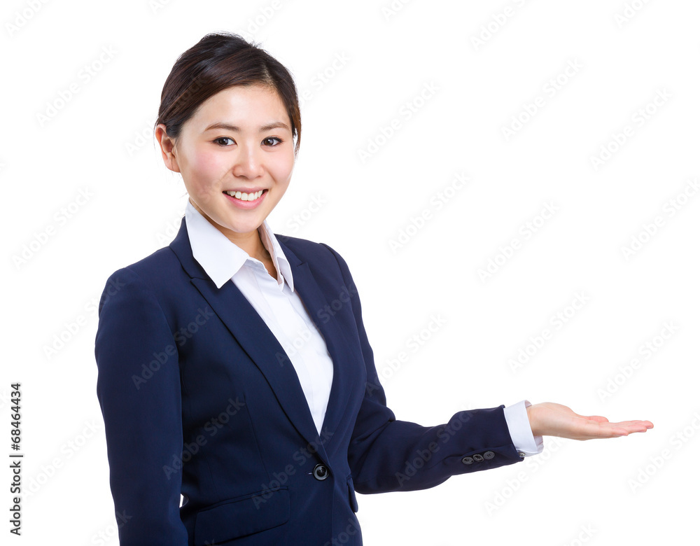 Young businesswoman with hand presentation Young businesswoman with hand presentation