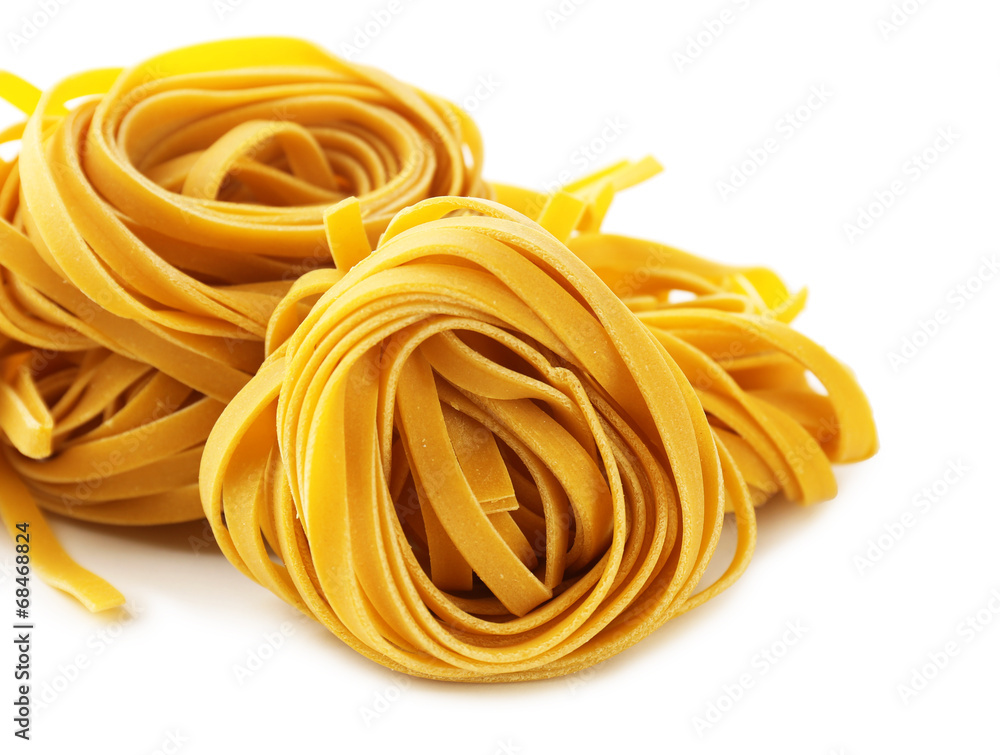 Raw homemade pasta, isolated on white Raw homemade pasta, isolated on white