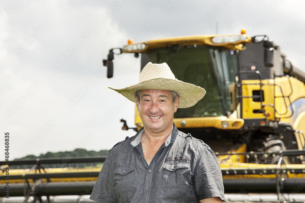 Farmer with combine harvester