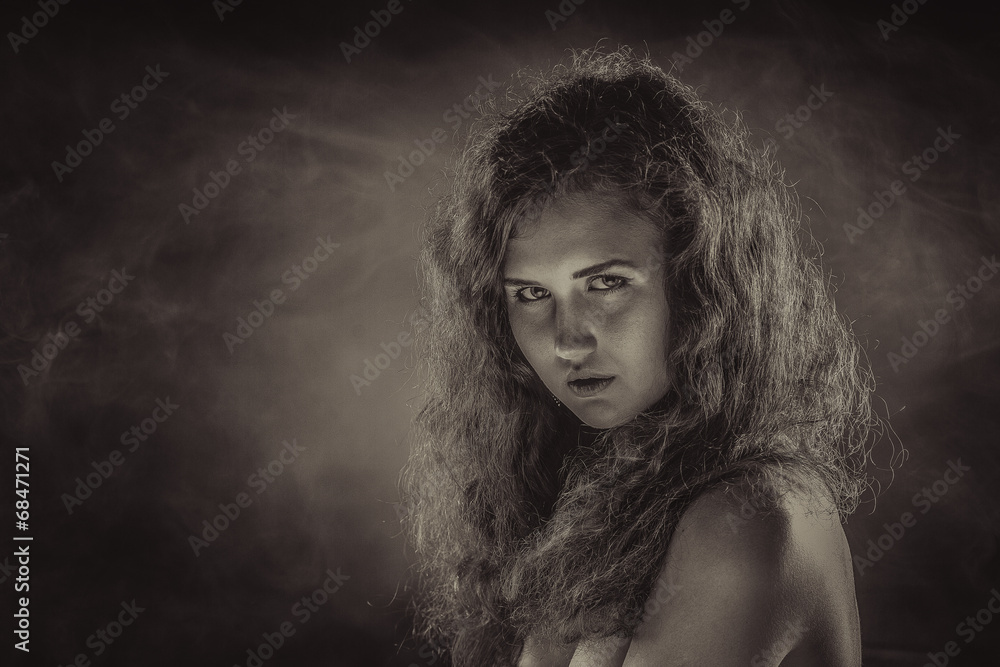 Studio portrait of young beautiful woman