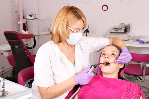 female dentist and girl patient