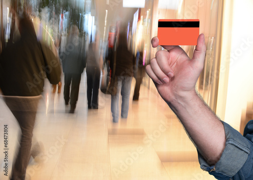 Man holding a credit card in his hand