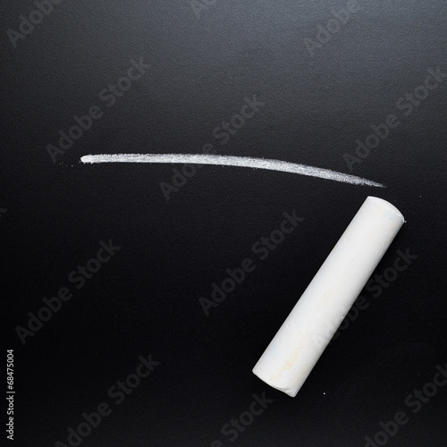 Drawn line next to a piece of chalk