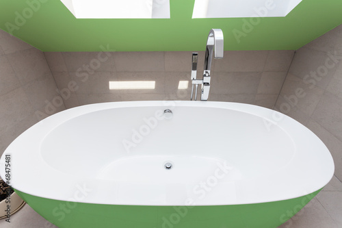 Green bathtub in bathroom