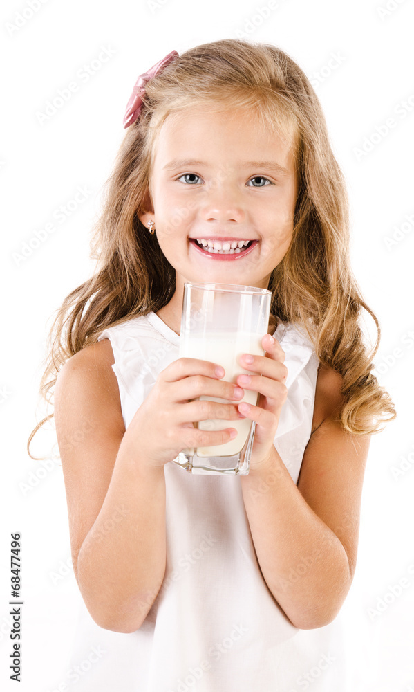 Smiling little girl drinking milk isolated on a white Smiling little girl drinking milk isolated on a white