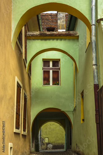 Medieval house with arcades and passage, Sighisoara, Romania photo