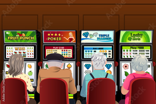 Senior people playing slot machines in the casino
