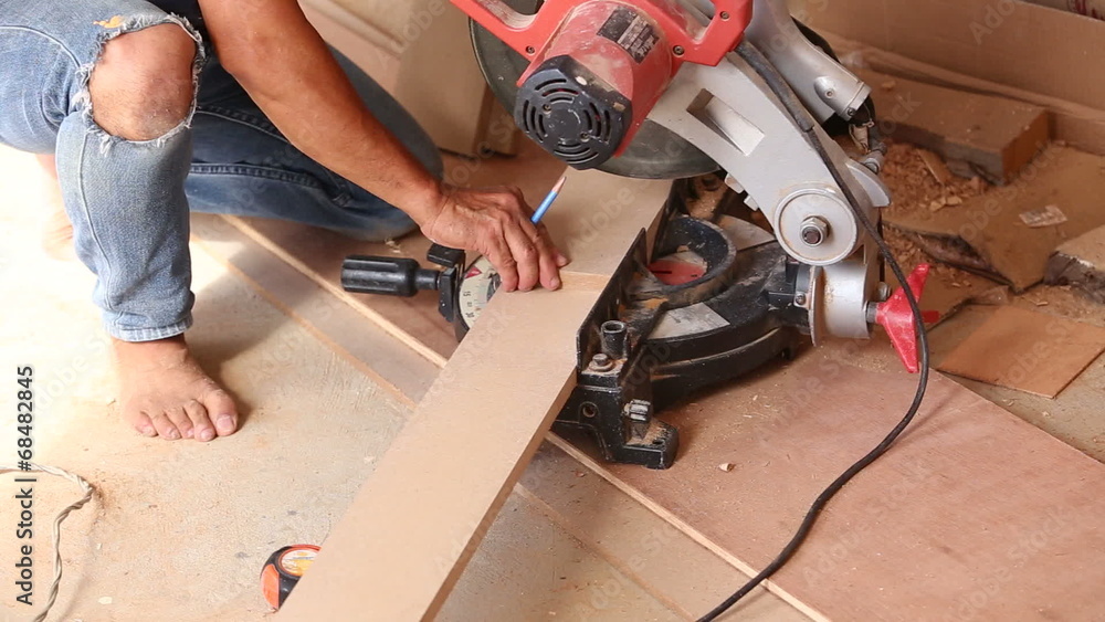 carpenter use saw cut wood for make new furniture carpenter use saw cut wood for make new furniture