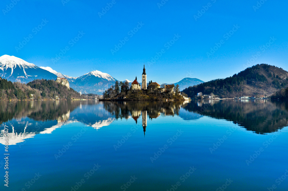 St. Martin Church on Island in Lake Bled with Mountains