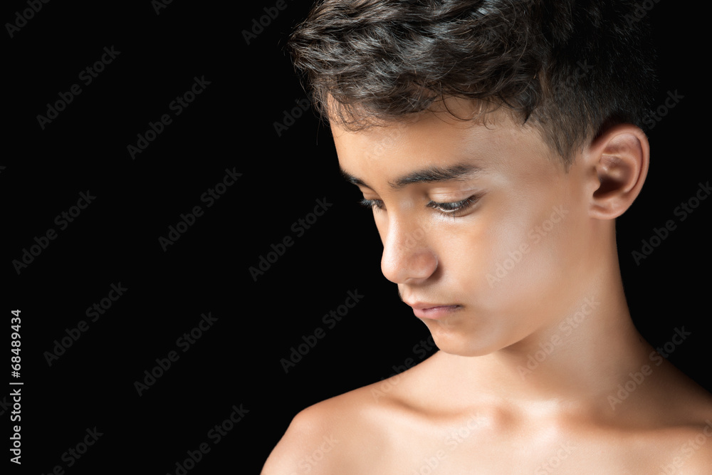Sad hispanic teenage boy isolated on black Stock Photo Adobe Stock