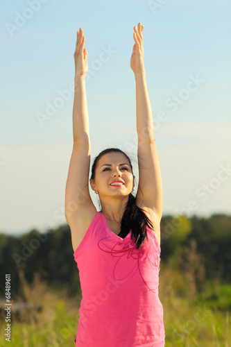 Girl practicing yoga outdoors
