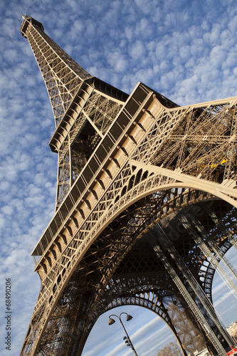 Eiffel Tower in Paris on the winter with the white clouds © danmir12
