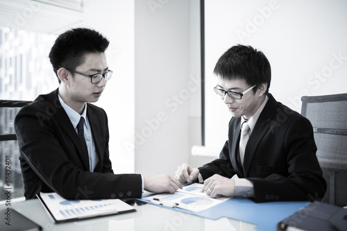 Wallpaper Mural Two Businessmen Having Informal Meeting In Modern Office Torontodigital.ca