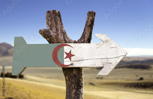 Algeria wooden sign with a desert background