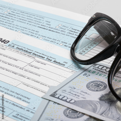 USA 1040 Tax Form with glasses and dollars - 1 to 1 ratio