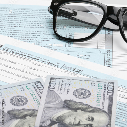 1040 Tax Form  glasses  calculator and dollars - 1 to 1 ratio