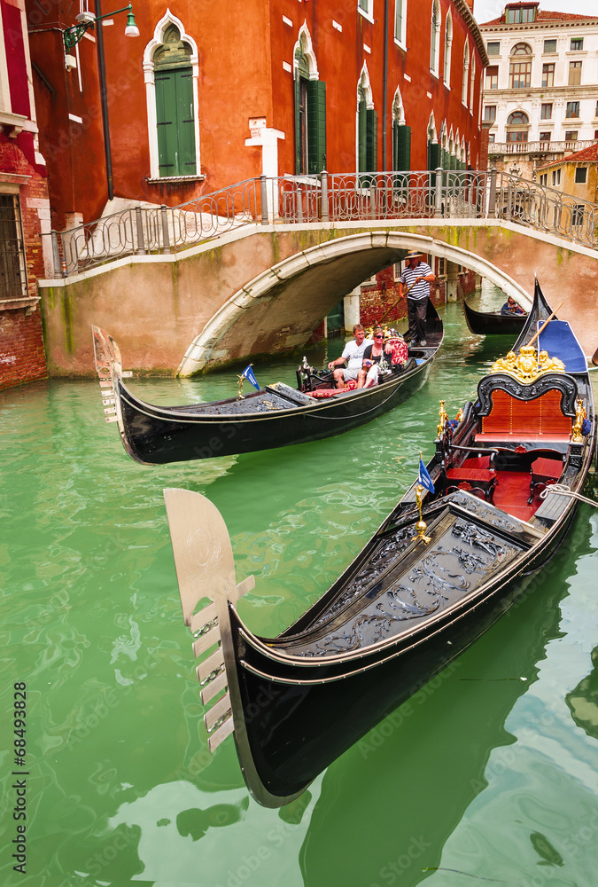 Romantic gondolas on canal in Venice, Italy
