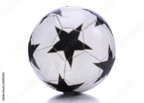 Old soccer ball on white