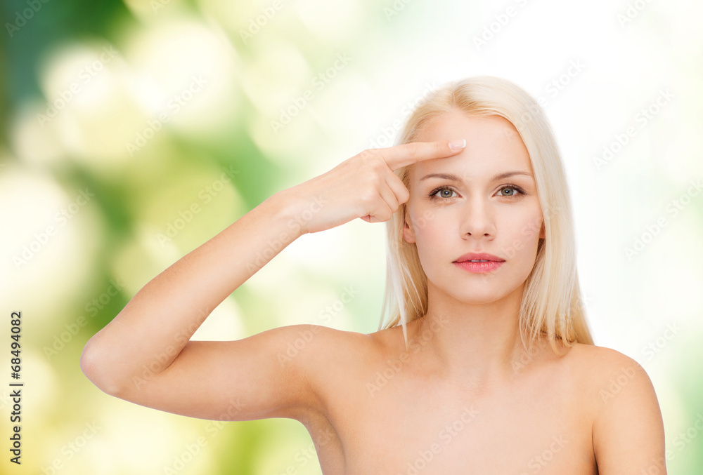 Fototapeta premium beautiful woman touching her forehead