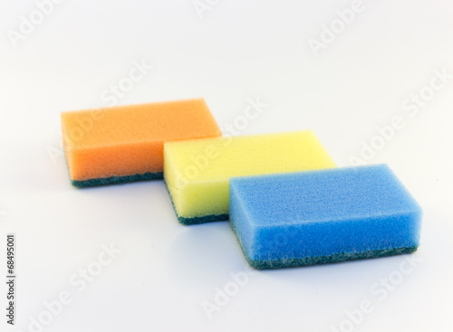 Three sponges for washing dishes on white background horizontal