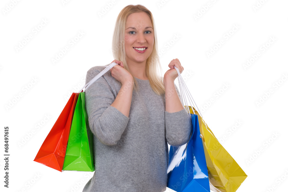 Blonde Frau beim Einkaufen mit Einkaufstaschen Blonde Frau beim Einkaufen mit Einkaufstaschen