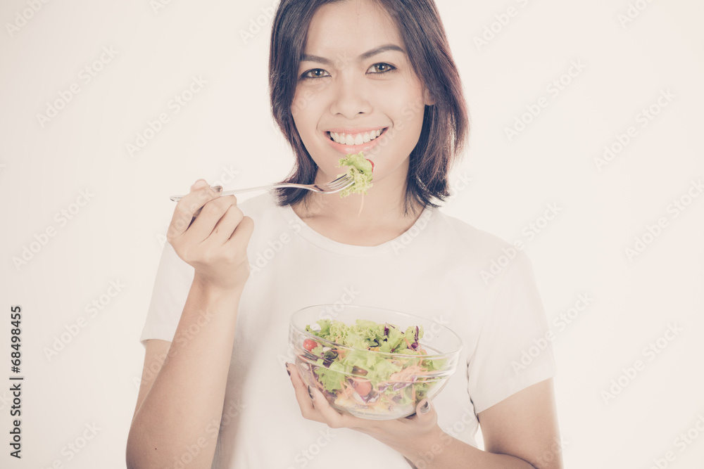 Pretty girl eating fresh vegetable salad Pretty girl eating fresh vegetable salad