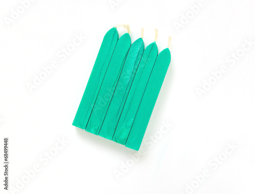 turquoise sealing wax candles isolated on white background with 