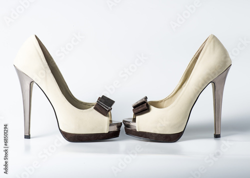 Woman beige shoes on white