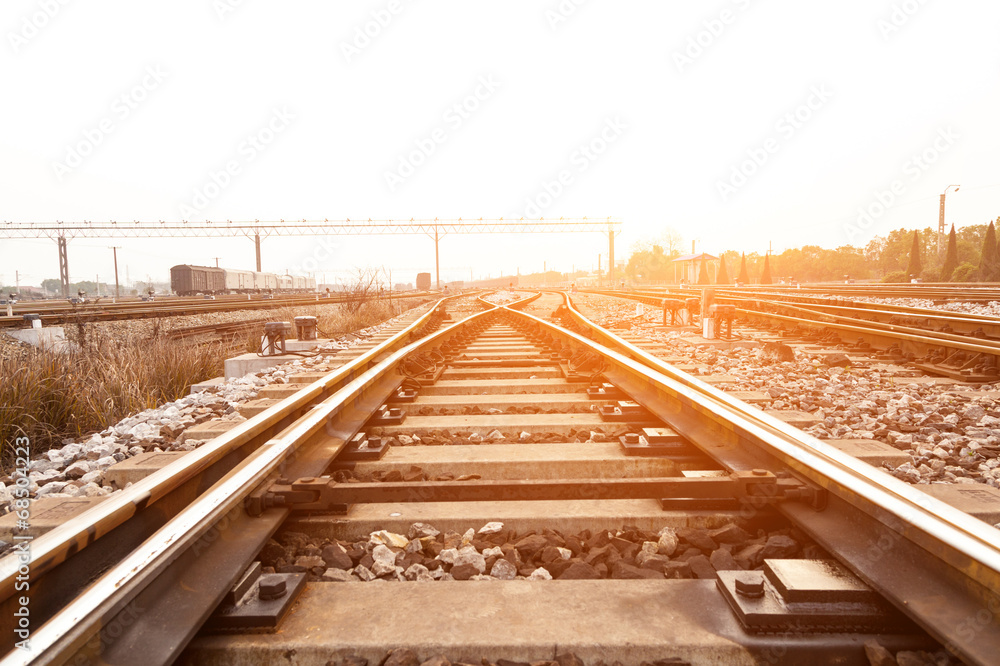Fototapeta premium Cargo train platform at sunset with container