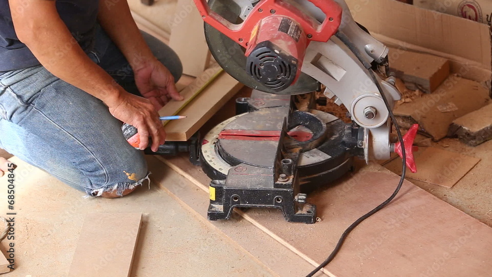 carpenter use saw cut wood for make new furniture carpenter use saw cut wood for make new furniture
