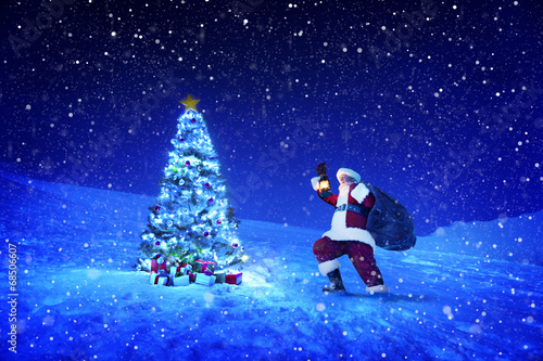 Santa Claus Holding Lantern and Sack on Snow