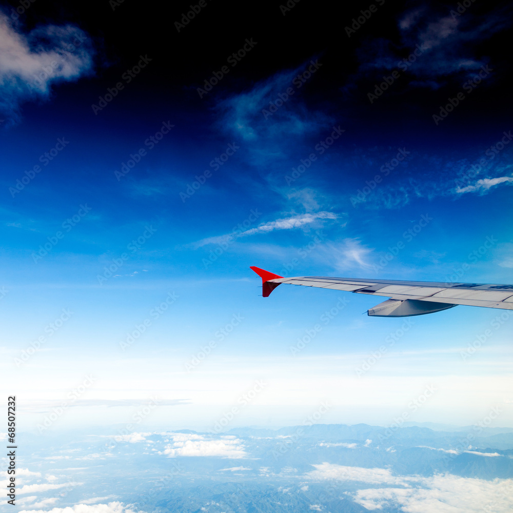 Fototapeta premium Classic image through aircraft window onto jet engine