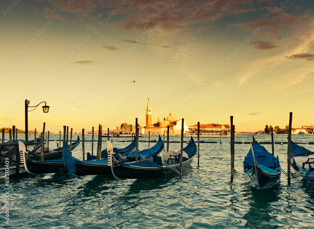 Naklejka premium Gondolas moored by Saint Mark square with San Giorgio di Maggior