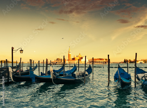 Gondolas moored by Saint Mark square with San Giorgio di Maggior © Valeri Luzina
