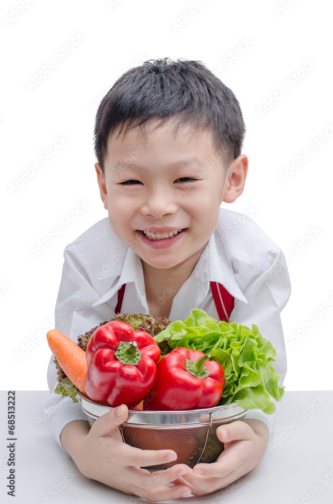 Asian boy chef and vegetable isolated on white background Asian boy chef and vegetable isolated on white background