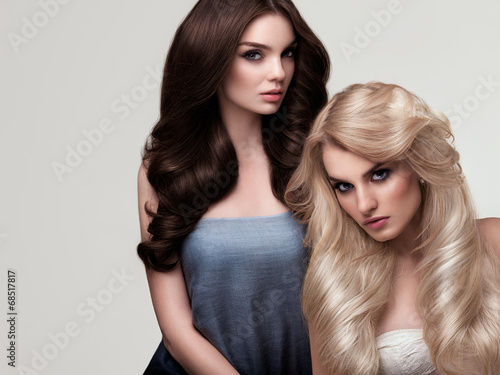 Fotografie Brown and Blonde Hair. Portrait of Beautiful Womans with Long Ha