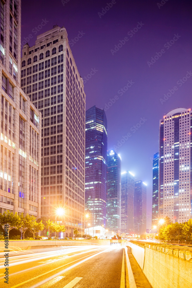 the light trails on the modern building background in china.