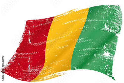 waving Guinean grunge flag photo
