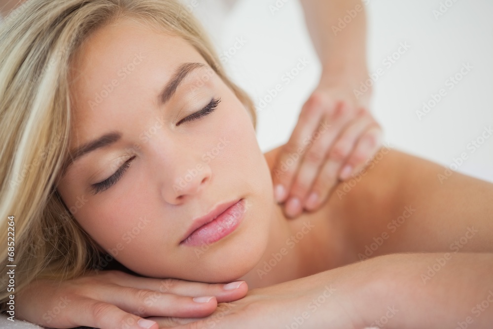 Pretty blonde enjoying a massage