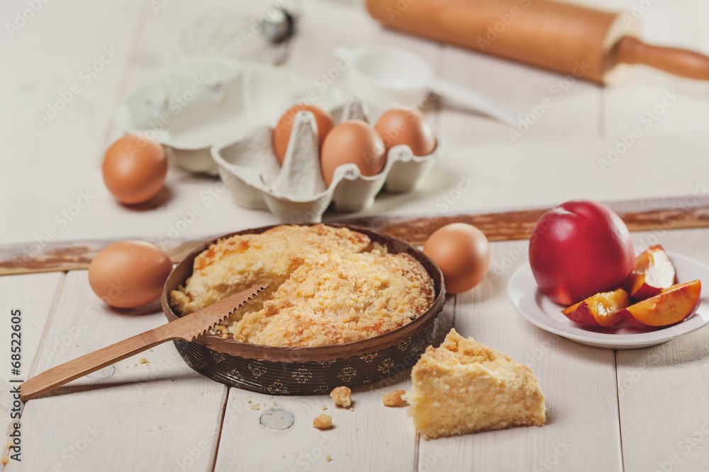 Peaches cake on white wooden planks Peaches cake on white wooden planks